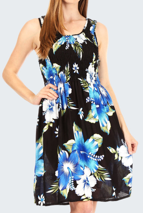 Woman wearing a black dress with blue floral pattern on a white background