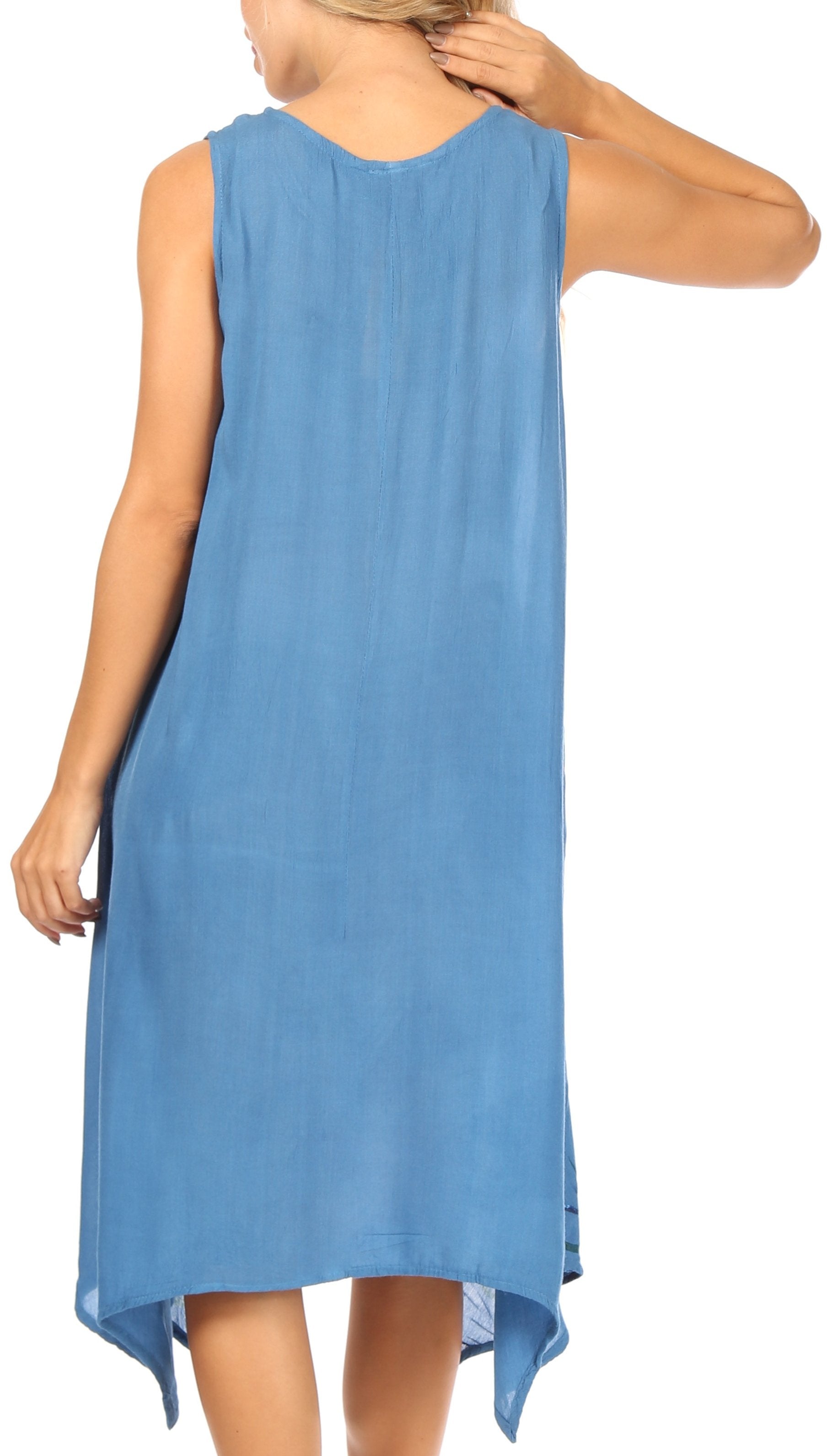 Woman wearing a blue sleeveless dress on a white background