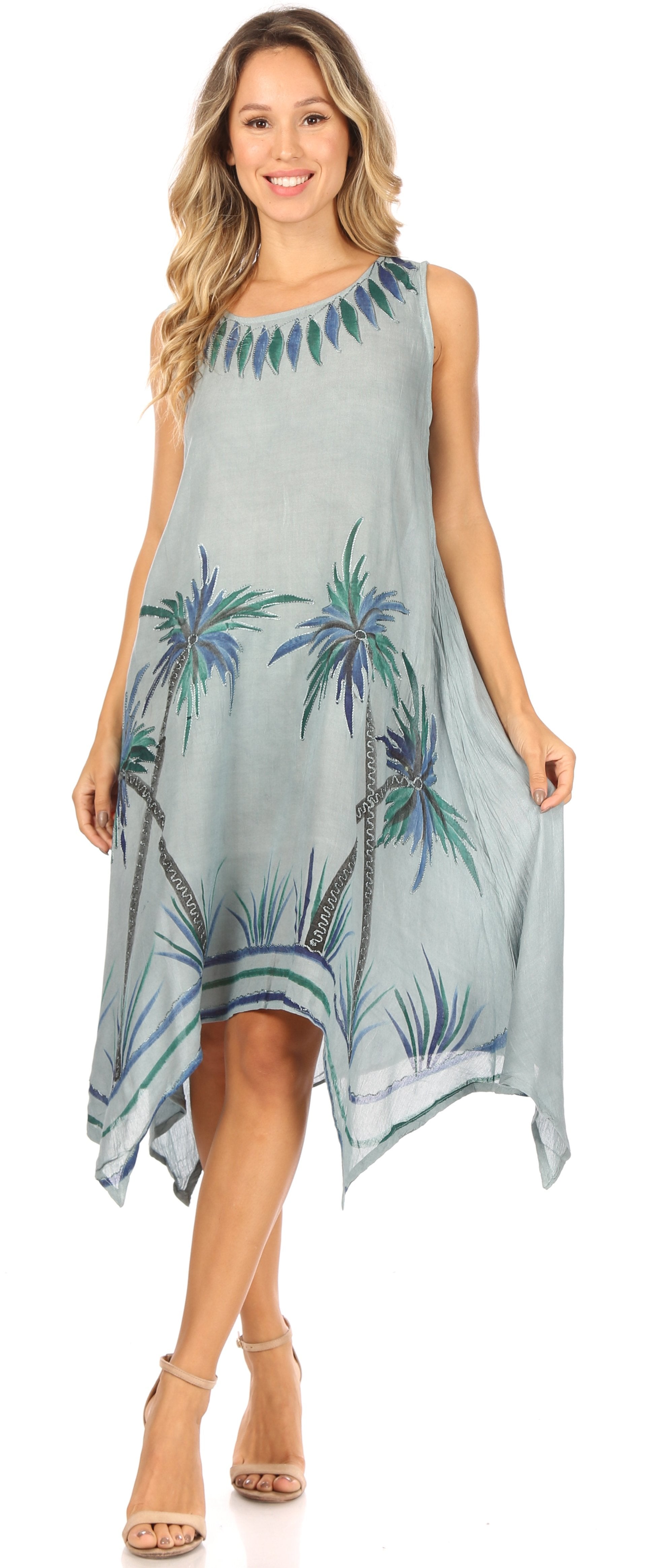 Woman wearing a sleeveless dress with floral pattern on a plain background
