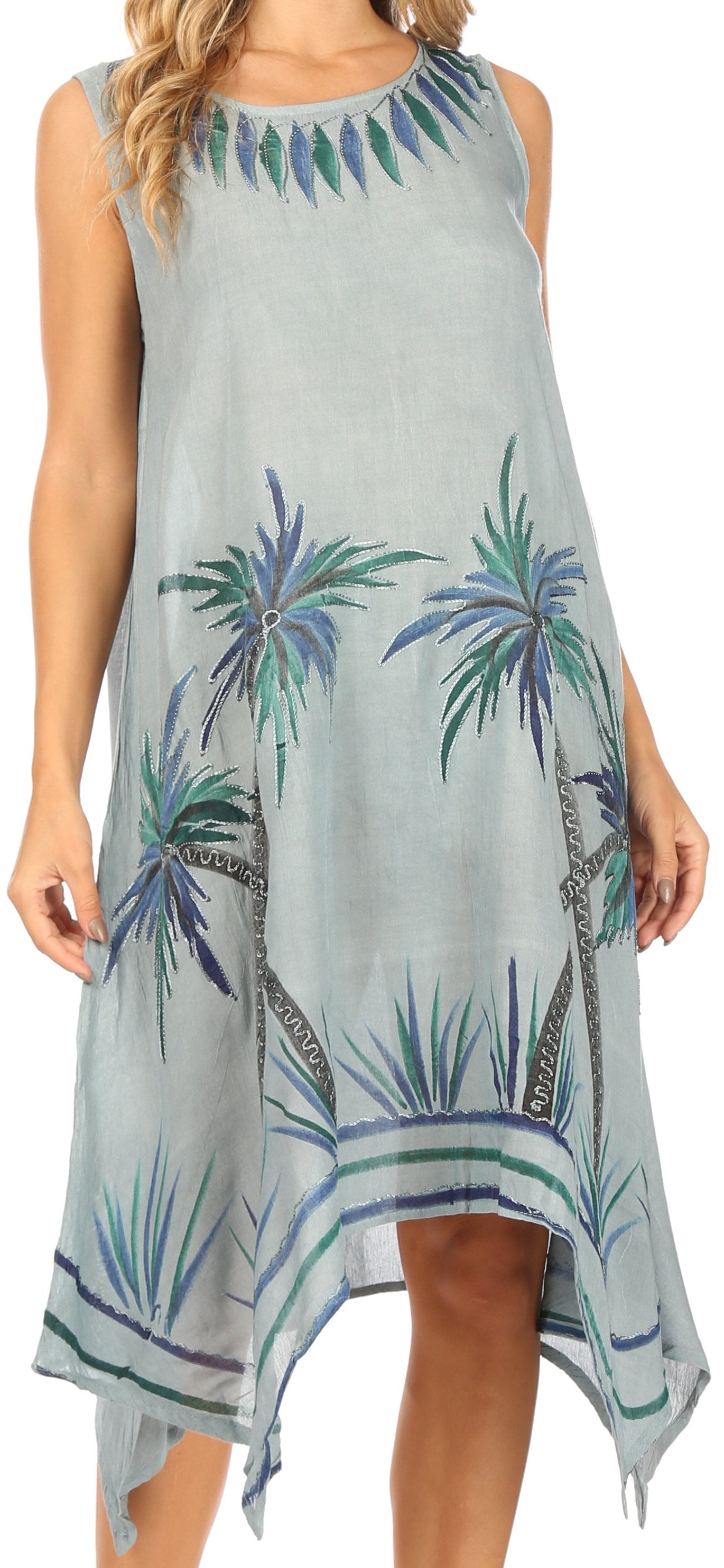 Woman wearing a sleeveless dress with palm tree pattern
