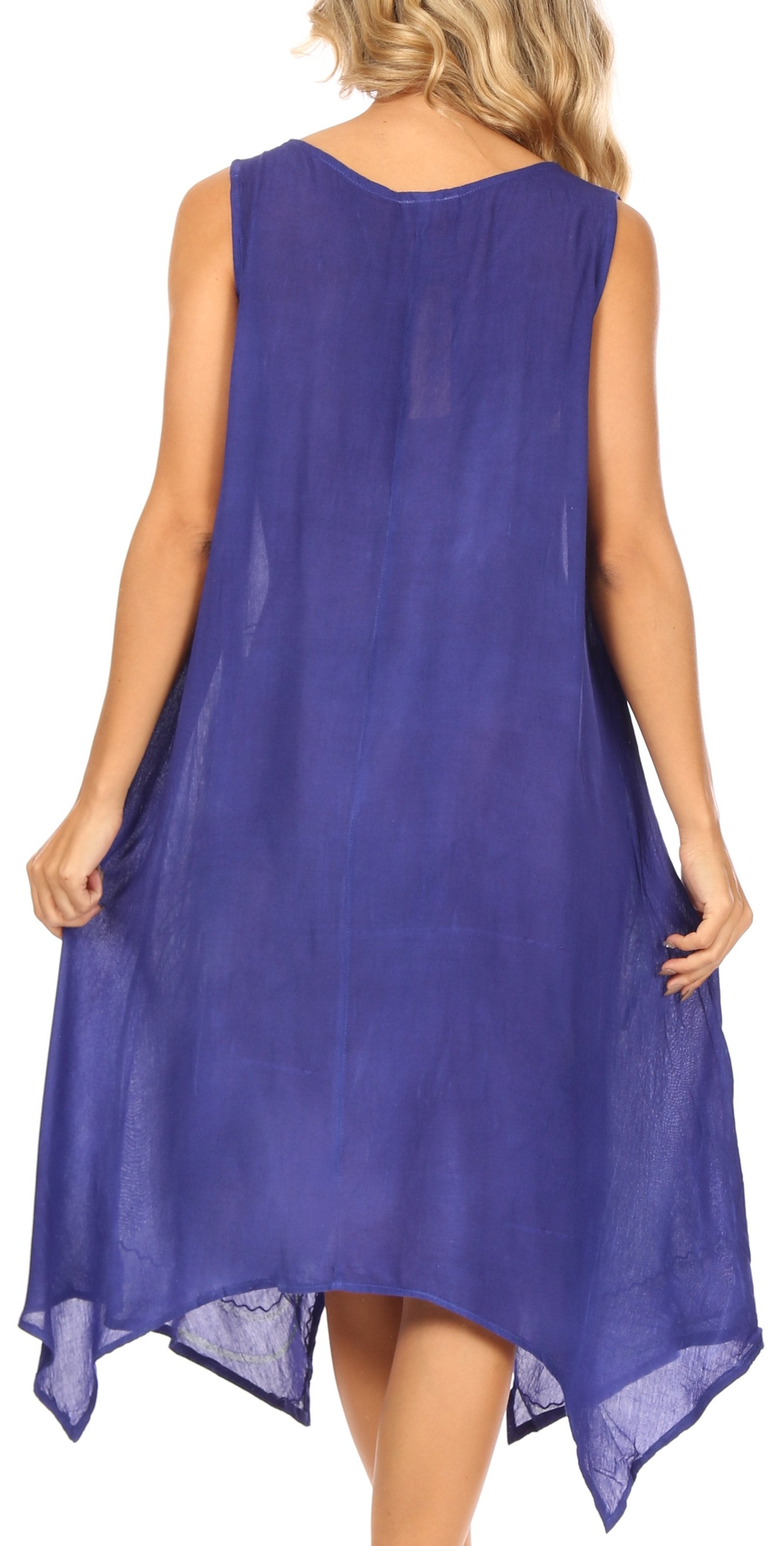 Woman wearing a sleeveless purple dress on a white background