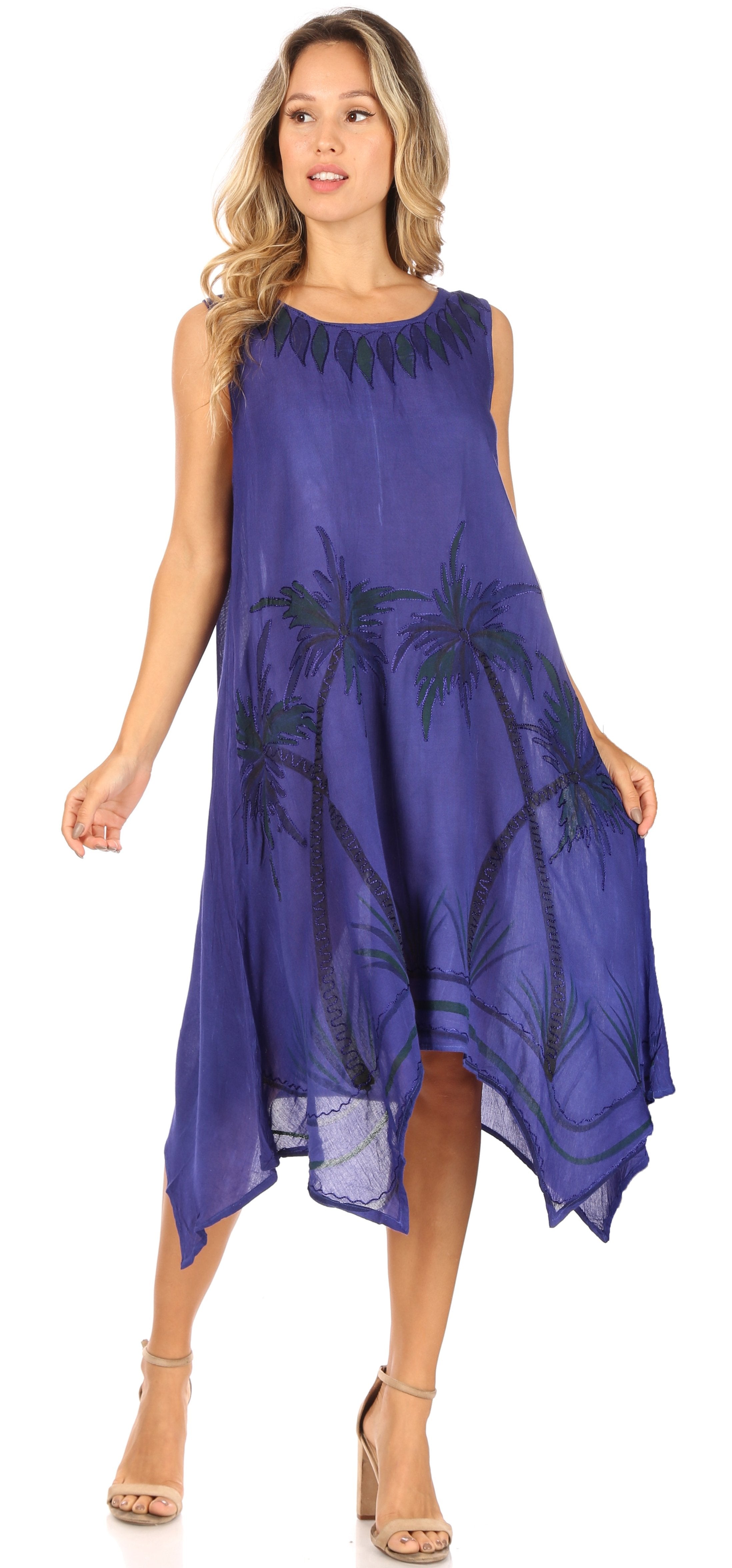 Woman wearing a purple dress with palm tree patterns on a white background