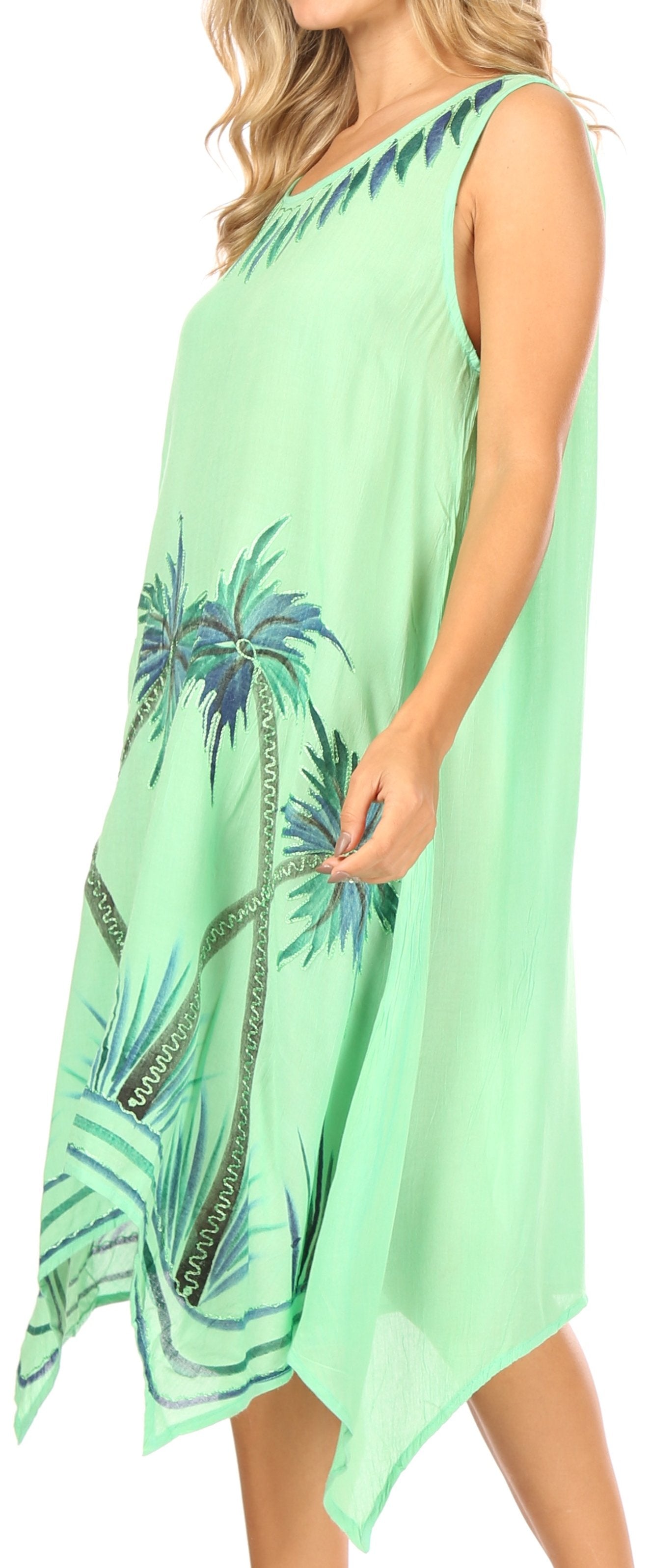 Green dress with palm tree pattern worn by a model