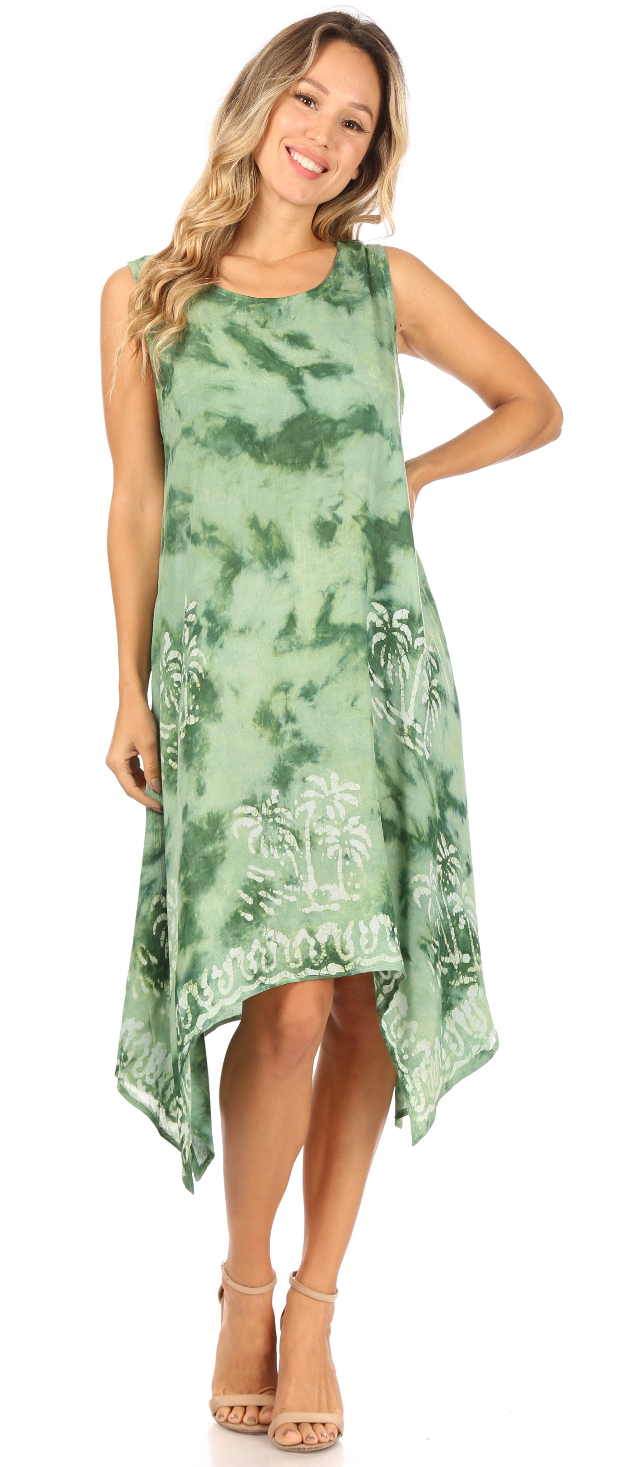 Woman wearing a green tie-dye dress with white patterns on a white background