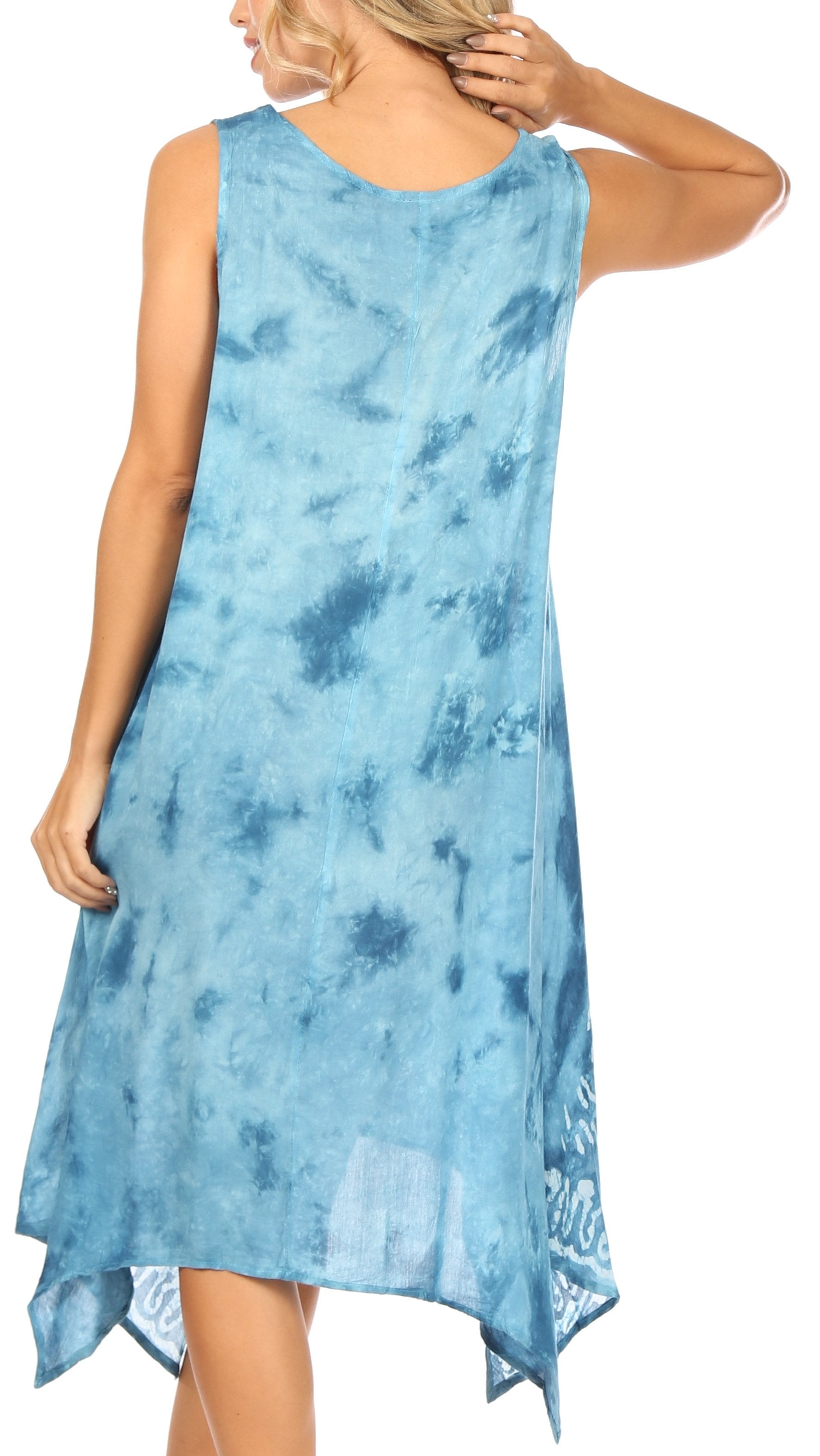 Woman wearing a blue tie-dye dress on a white background