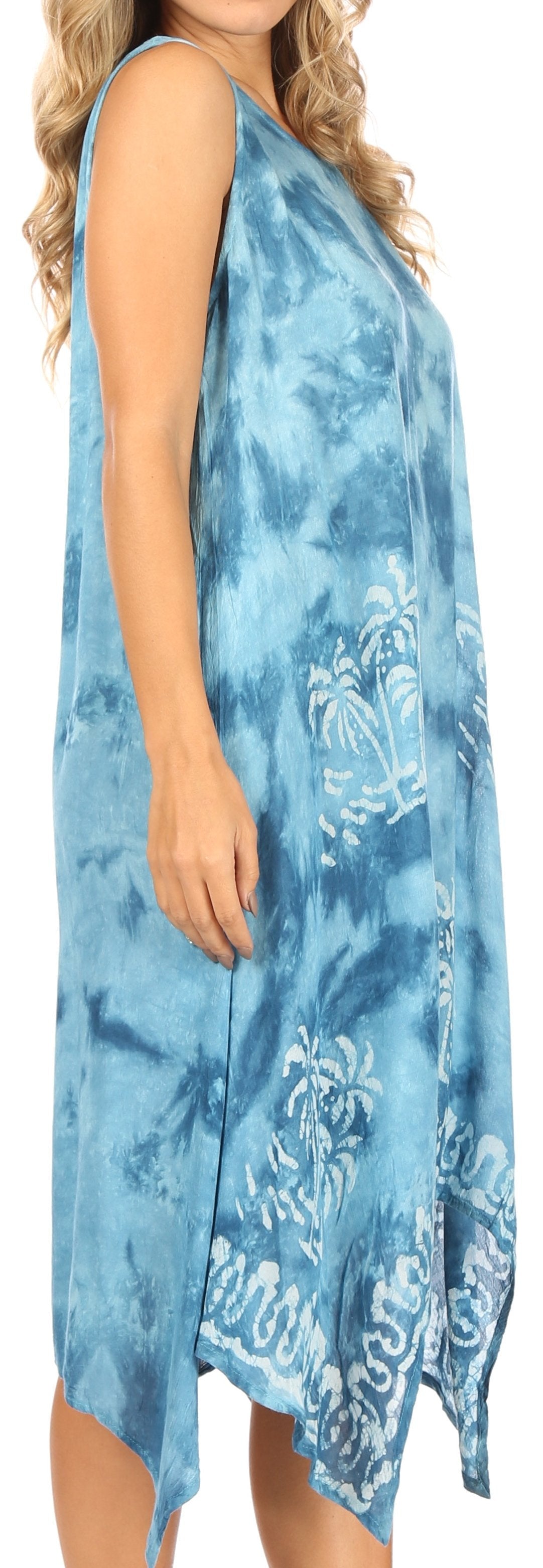 Woman wearing a blue tie-dye dress with floral patterns.