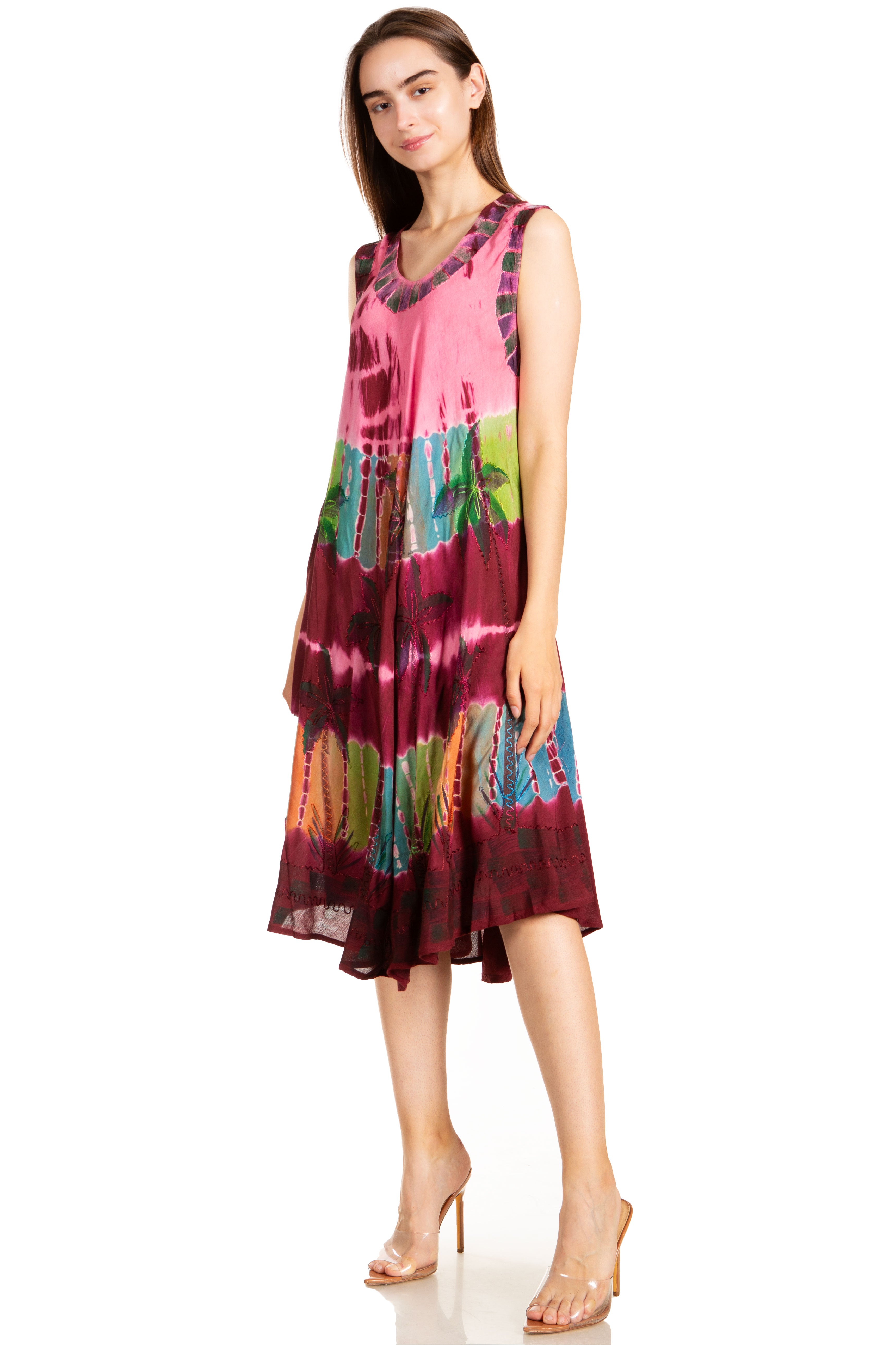 Woman wearing a colorful tie-dye dress on a white background