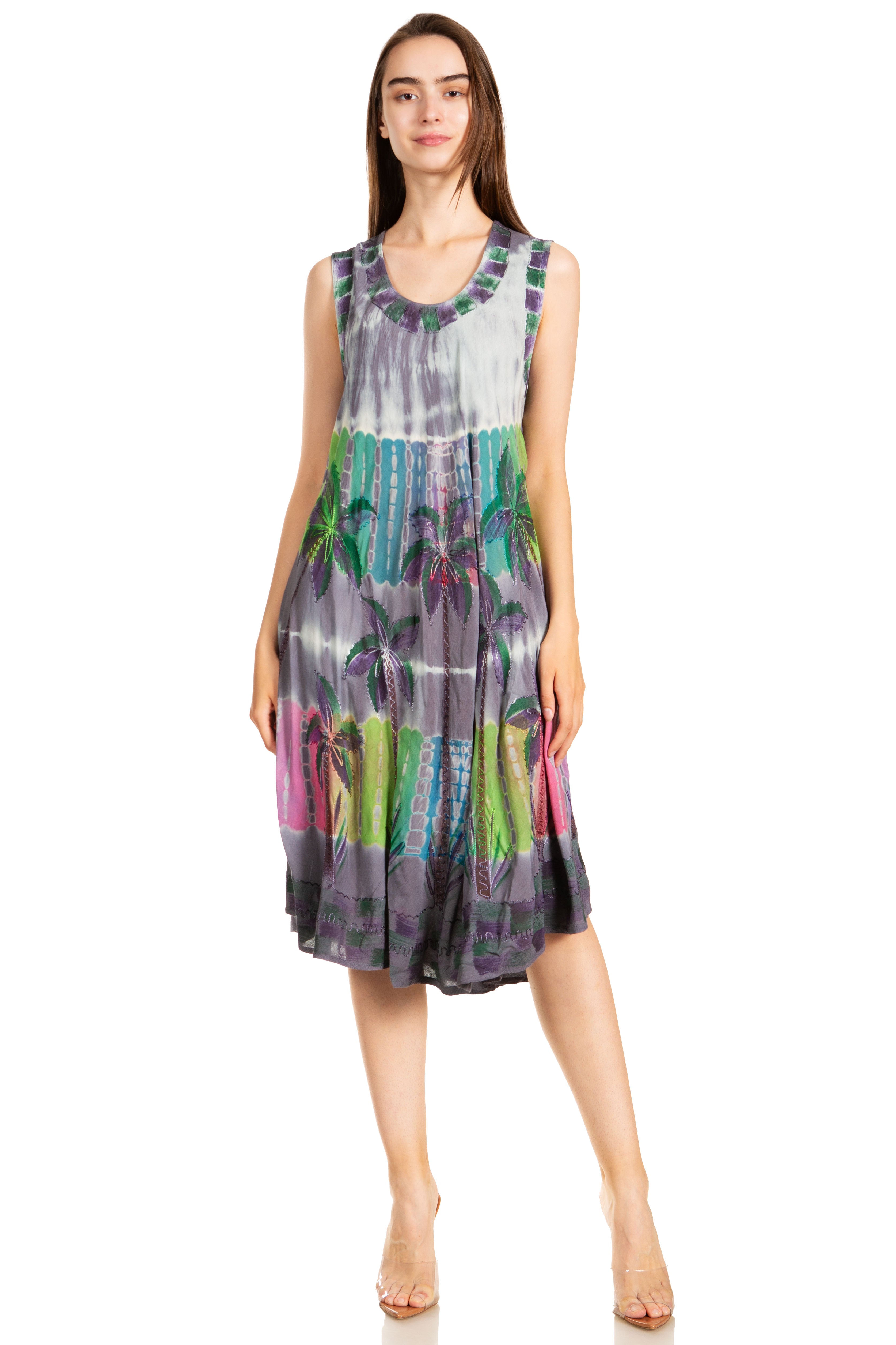 Woman wearing a colorful patterned dress on a white background