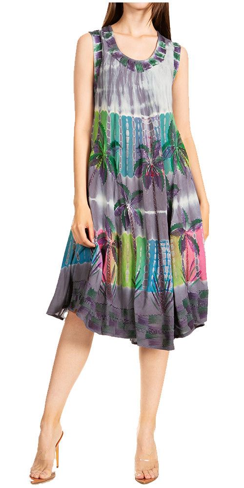 Woman wearing a sleeveless dress with a colorful abstract pattern on a white background