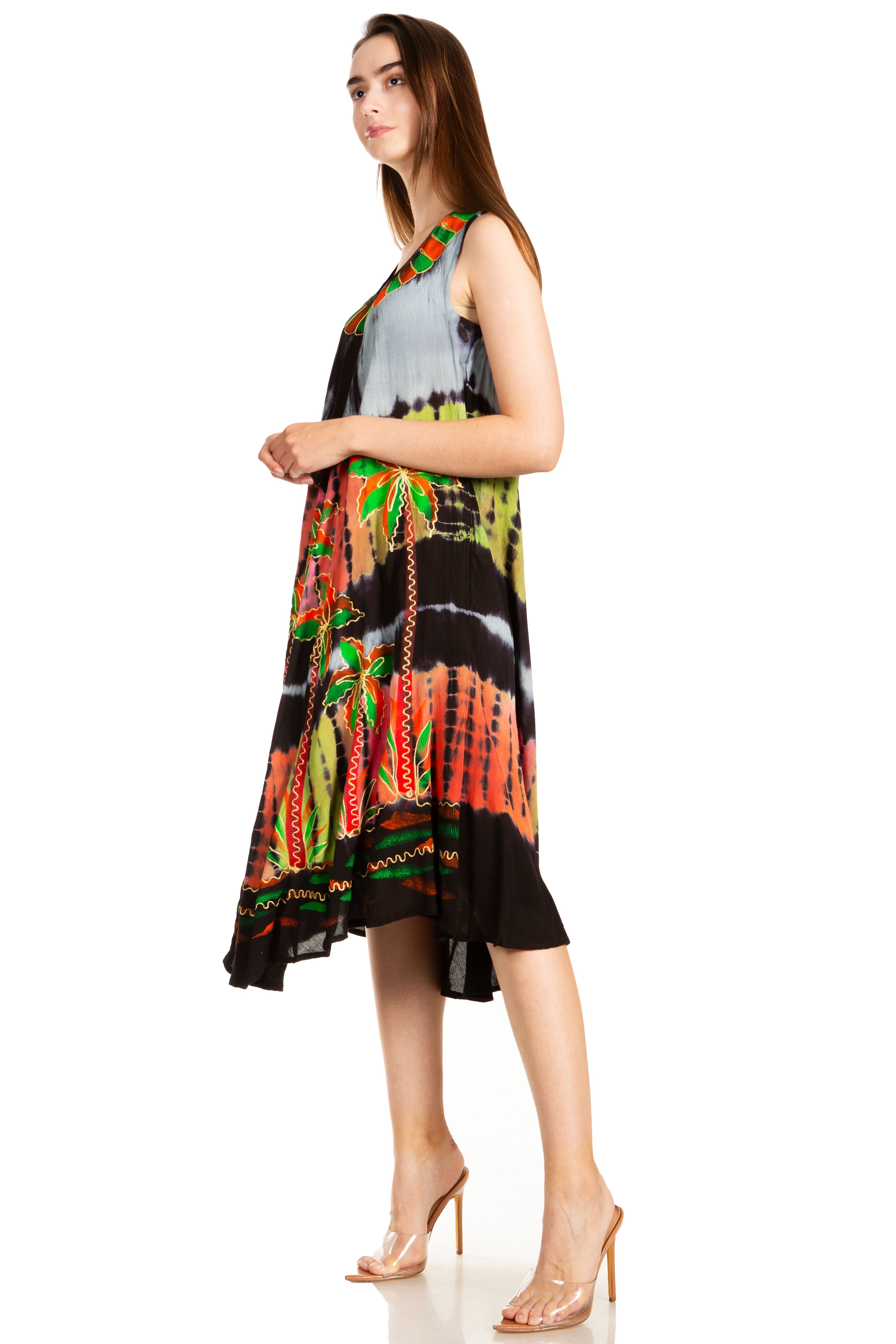 Woman wearing a colorful sleeveless dress on a white background