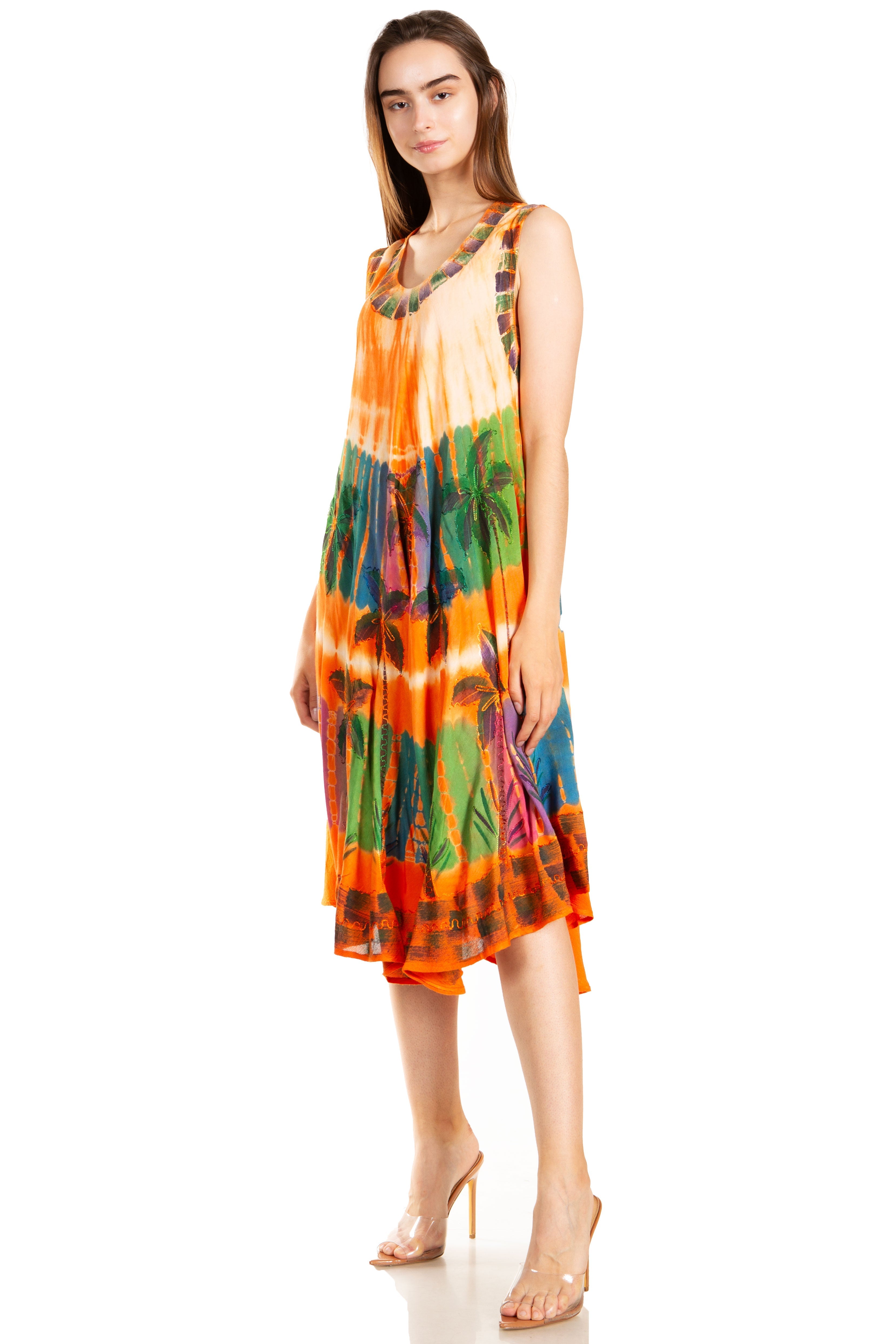 Woman wearing a colorful tie-dye dress on a white background