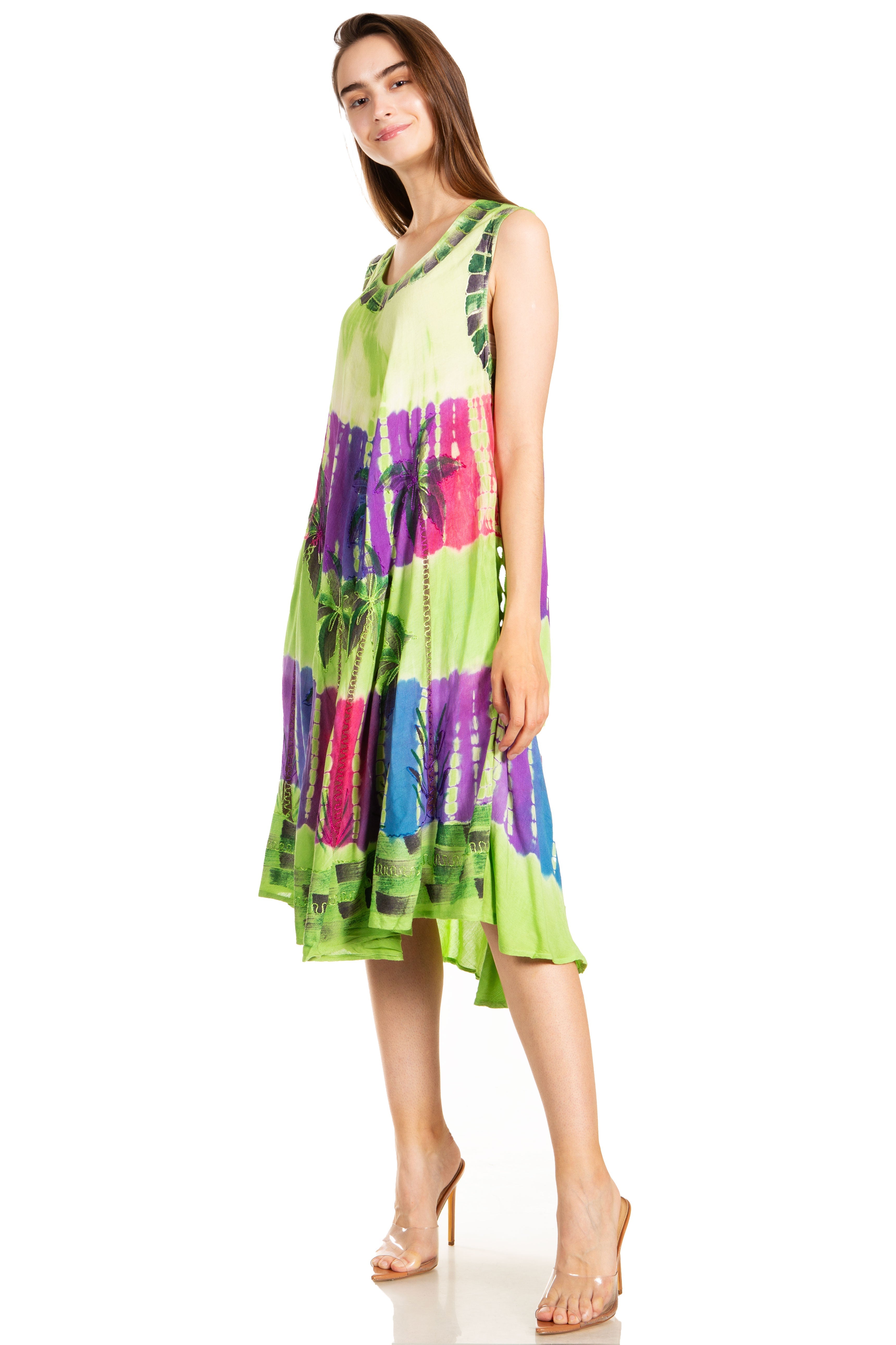 Woman wearing a colorful tie-dye dress on a white background