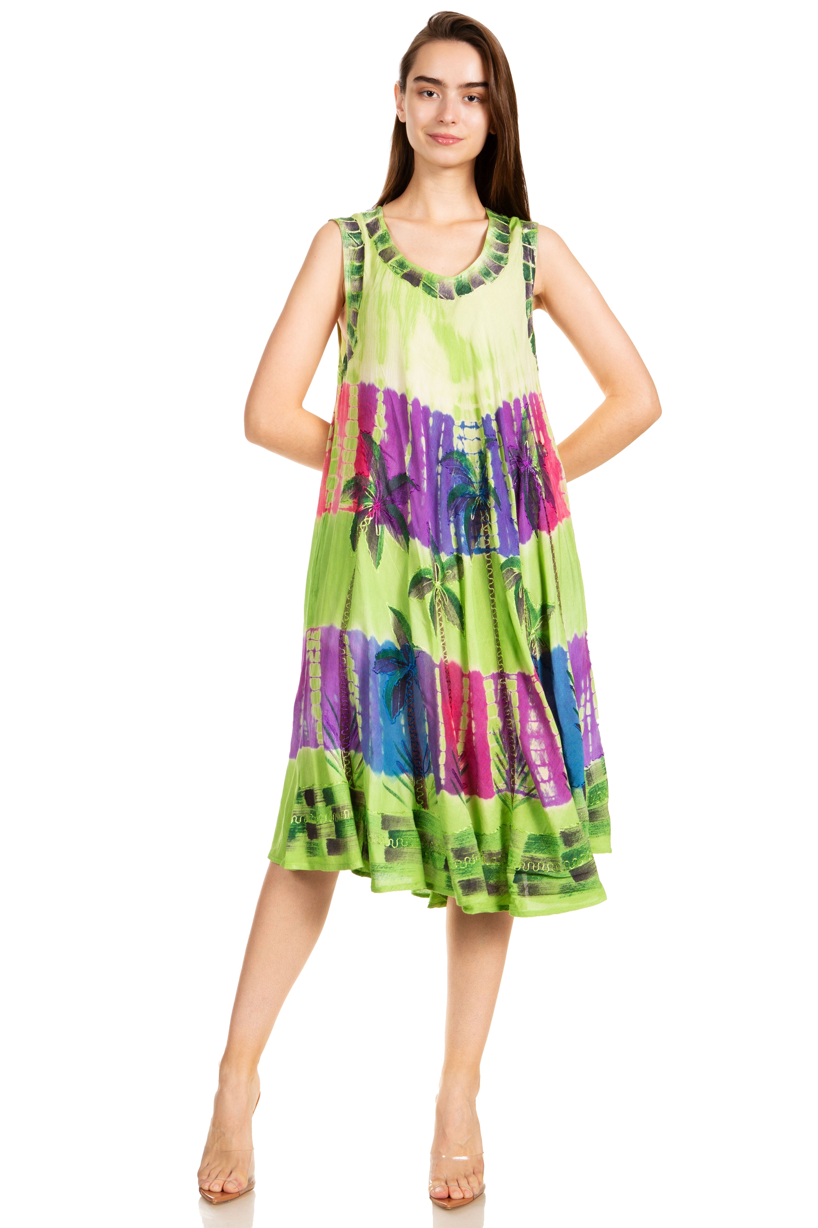 Woman wearing a colorful sleeveless dress on a white background
