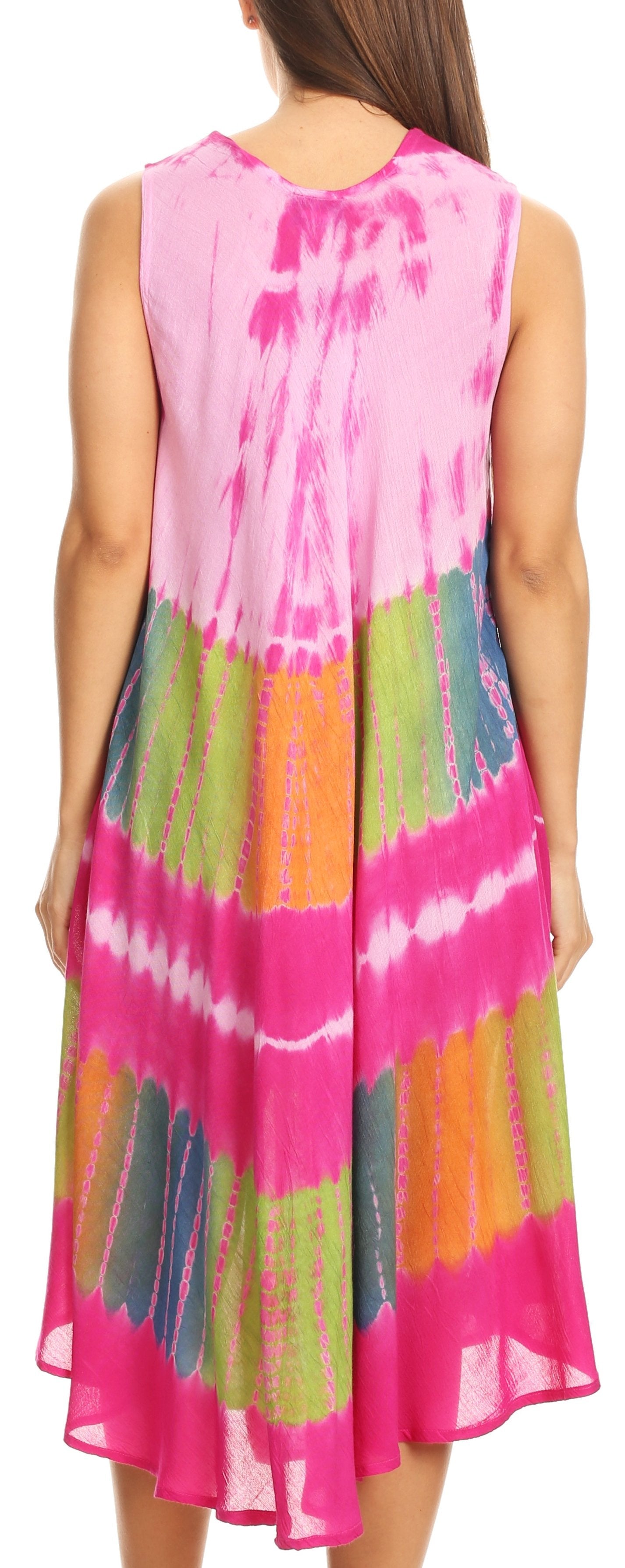Woman wearing a colorful tie-dye dress with a vibrant pink background