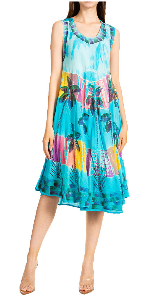 Woman wearing a colorful dress with a tropical pattern on a white background