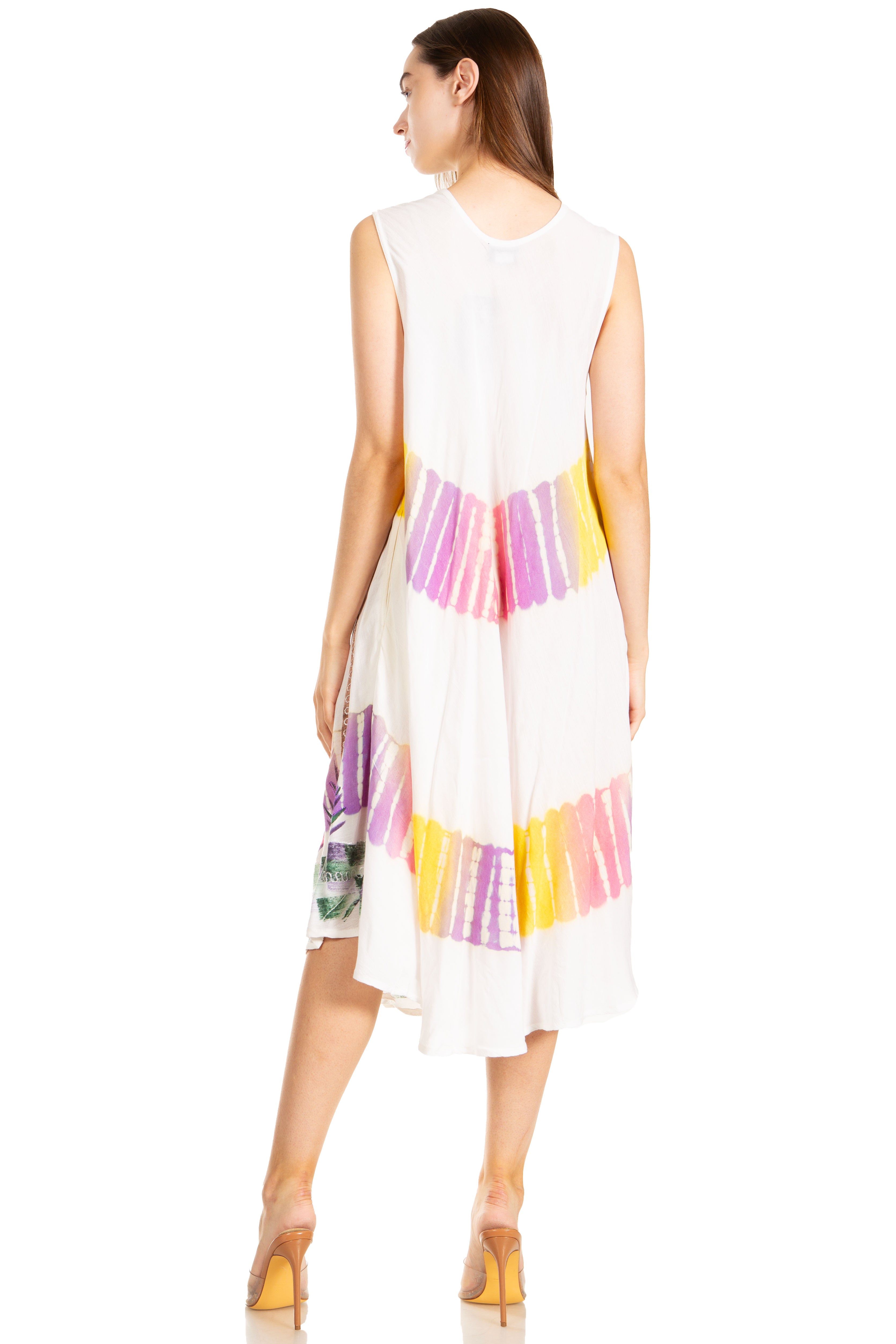 Woman wearing a white sleeveless dress with colorful striped pattern on a white background