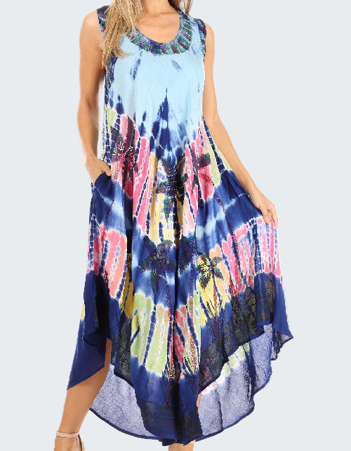 Woman wearing a tie-dye dress with a colorful pattern on a white background