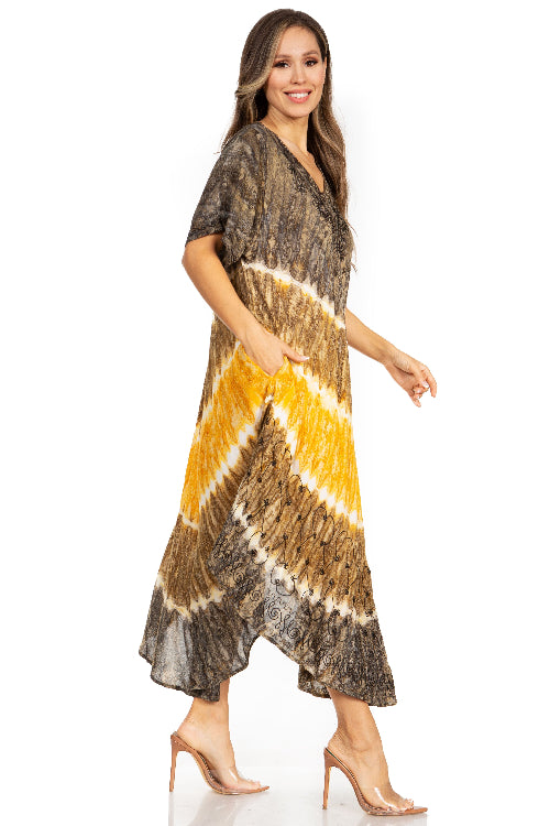 Woman wearing a tie-dye dress with brown, yellow, and white pattern on a white background