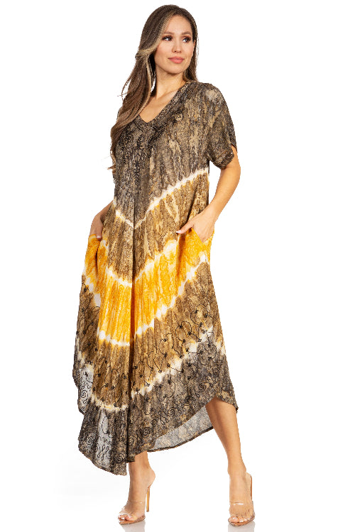 Woman wearing a long, patterned dress with a gradient design on a white background