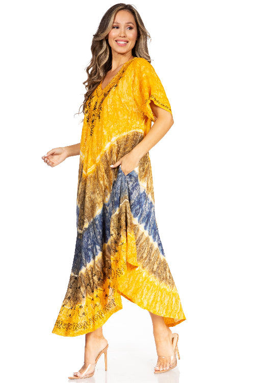 Woman wearing a yellow and blue patterned dress on a white background