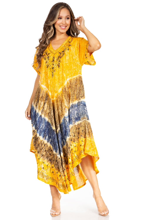 Woman wearing a yellow tie-dye dress with a white background