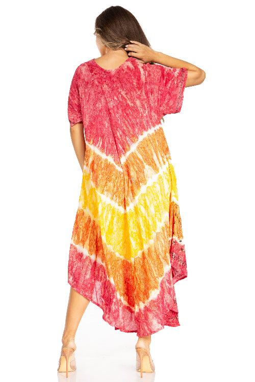 Woman wearing a tie-dye dress with pink, orange, and yellow gradient on a white background