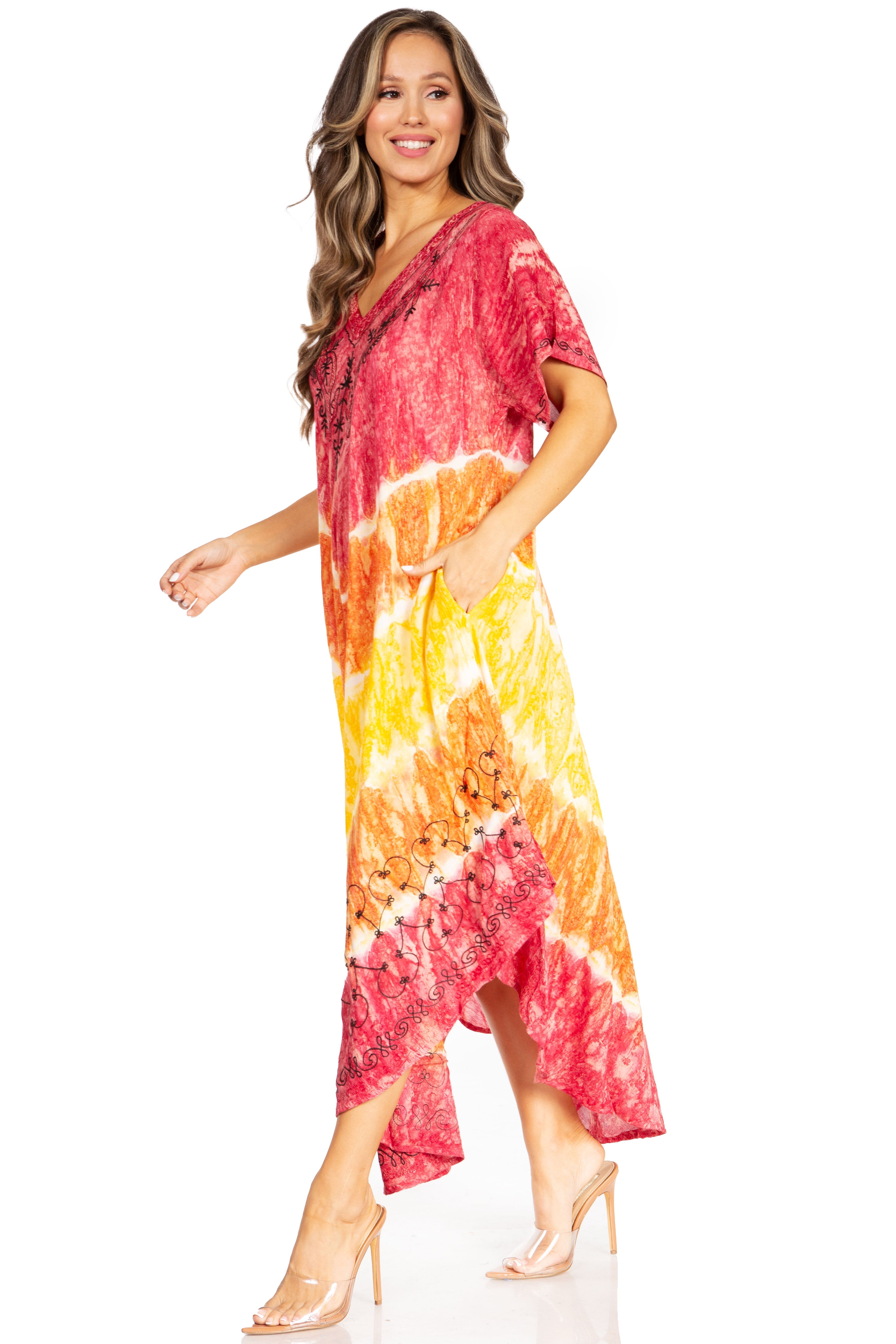 Woman wearing a tie-dye dress with red, orange, and yellow pattern on a white background