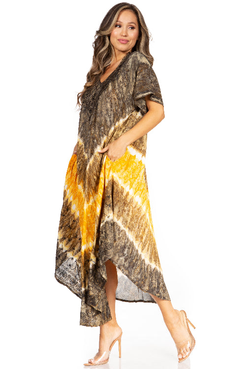 Woman wearing a tie-dye dress with brown, yellow, and black patterns on a white background