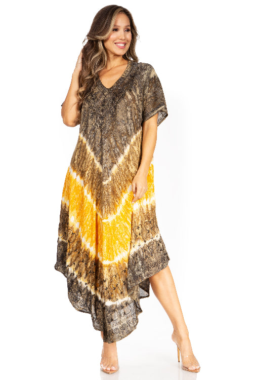 Woman wearing a tie-dye dress with brown and yellow pattern on a white background