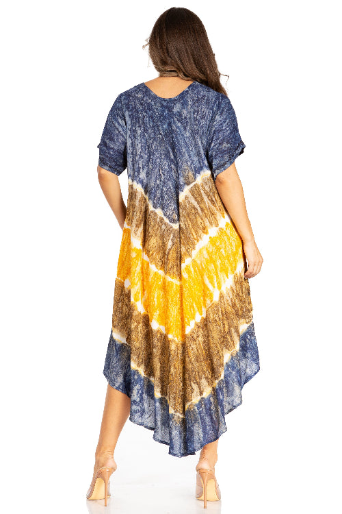 Woman wearing a tie-dye dress with blue, yellow, and brown patterns on a white background