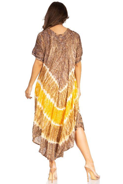 Woman wearing a patterned dress with a tie-dye design on a white background