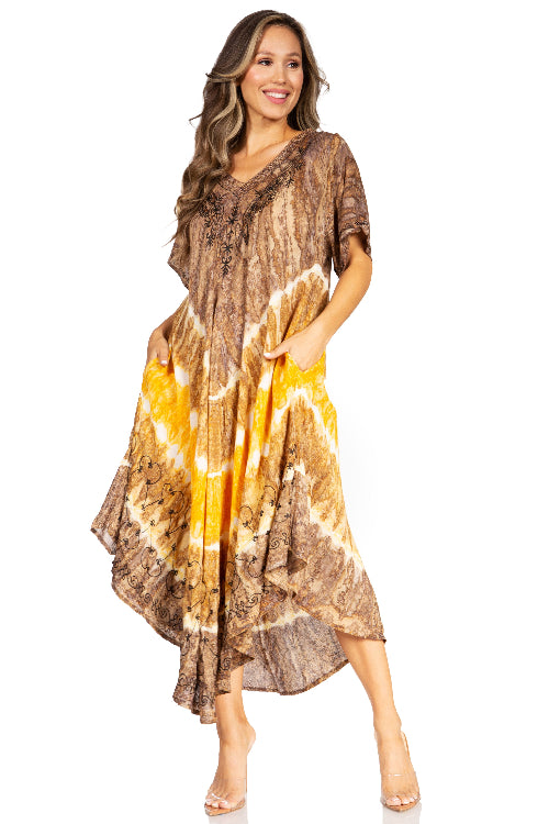 Woman wearing a tie-dye dress with brown, yellow, and white pattern on a white background