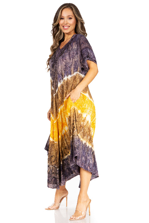 Woman wearing a tie-dye dress with purple, yellow, and brown colors on a white background