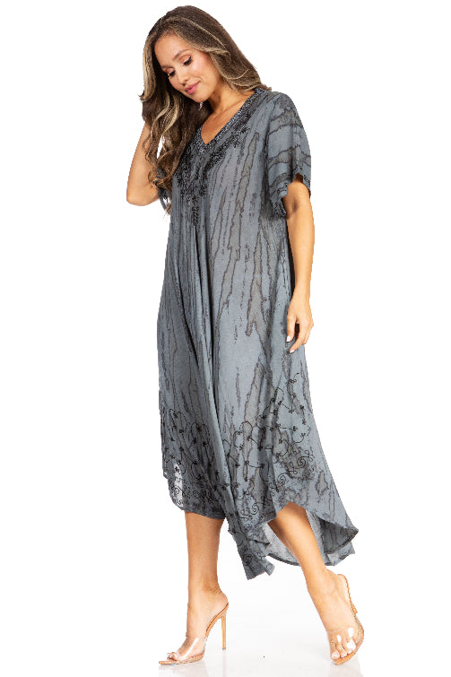 Woman wearing a gray lace dress on a white background
