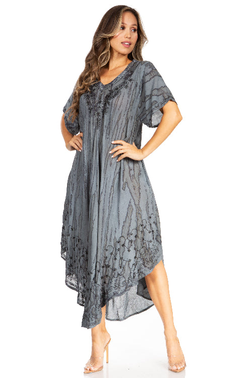 Woman wearing a gray patterned dress on a white background