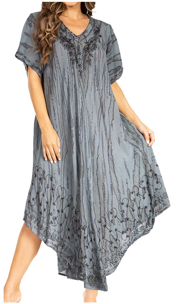 Woman wearing a gray patterned dress on a white background
