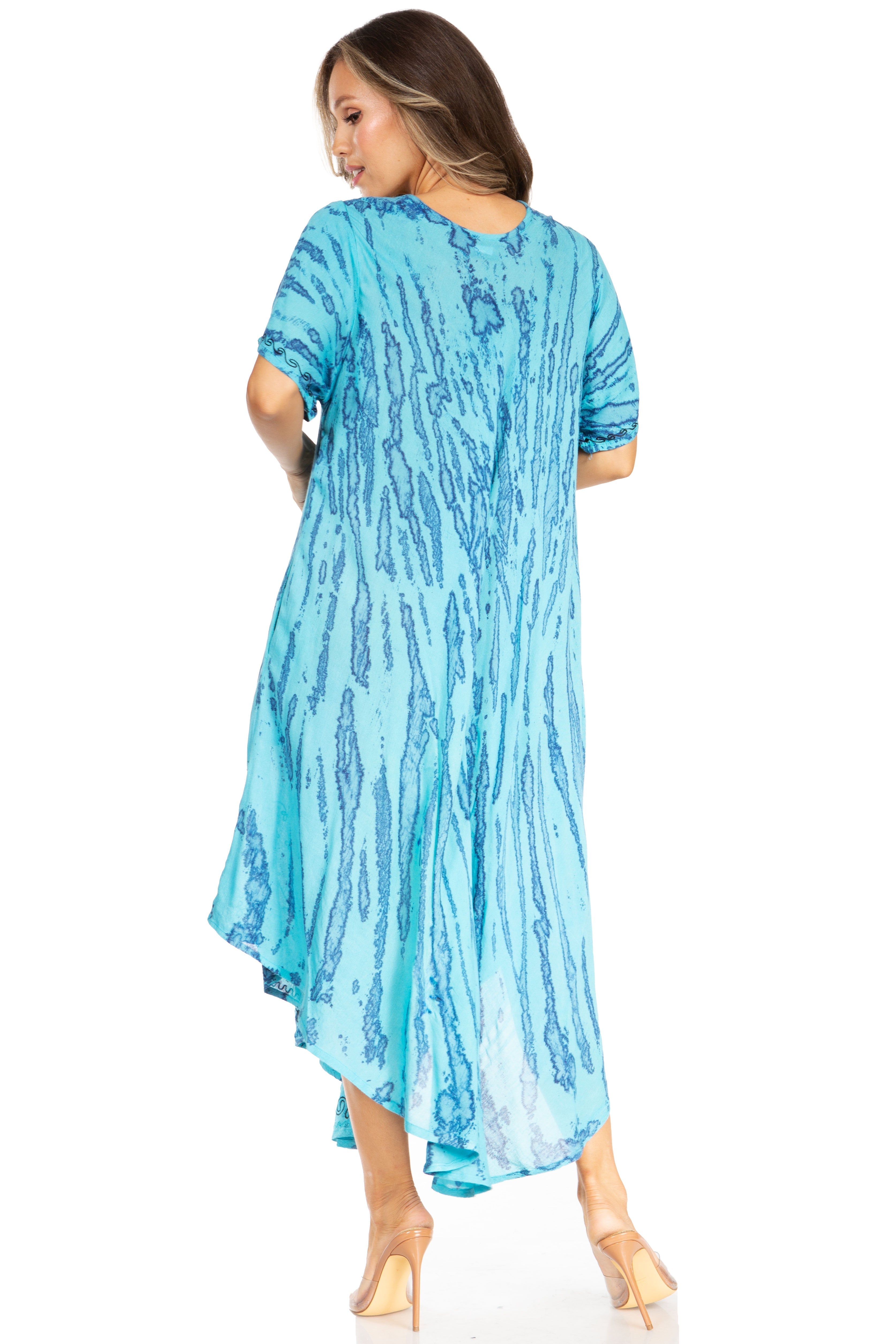 Woman wearing a blue patterned dress on a white background