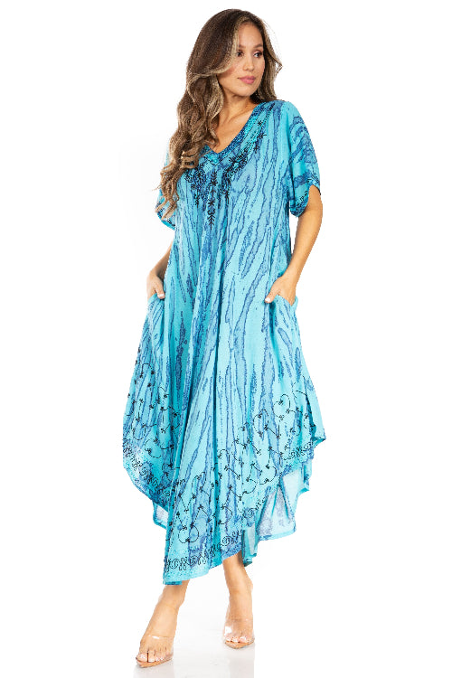 Woman wearing a blue patterned dress on a white background