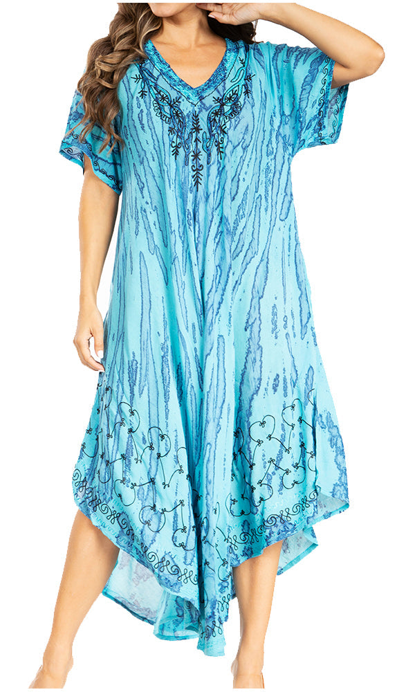 Woman wearing a blue patterned dress on a white background