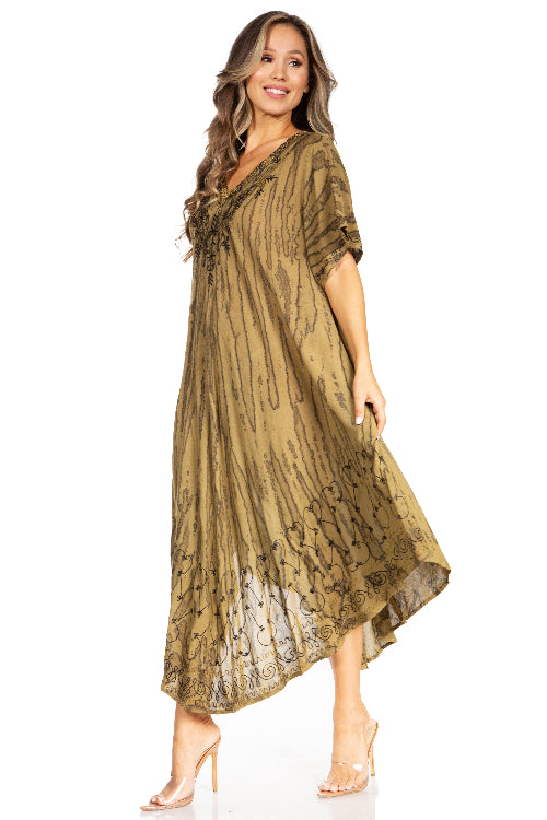 Woman wearing a long, patterned dress on a white background