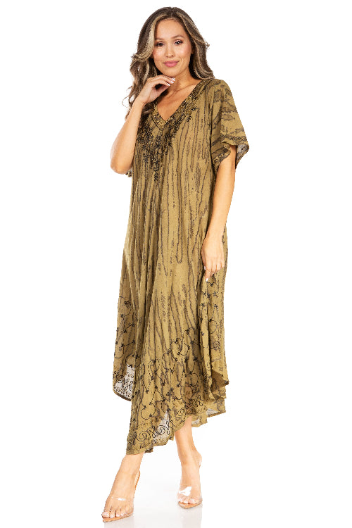 Woman wearing a long, patterned dress on a white background