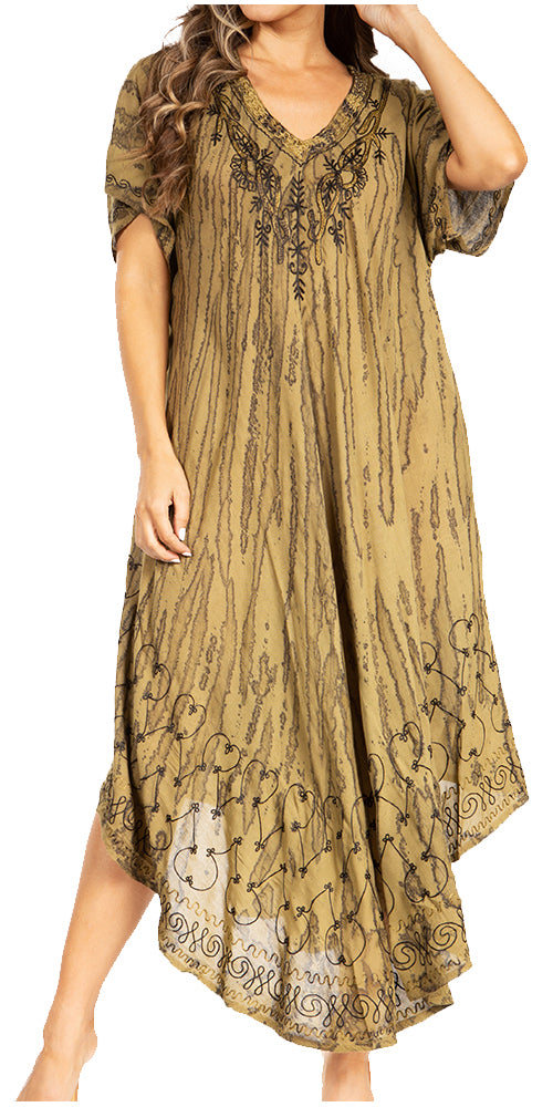 Woman wearing a long, patterned dress with short sleeves on a white background