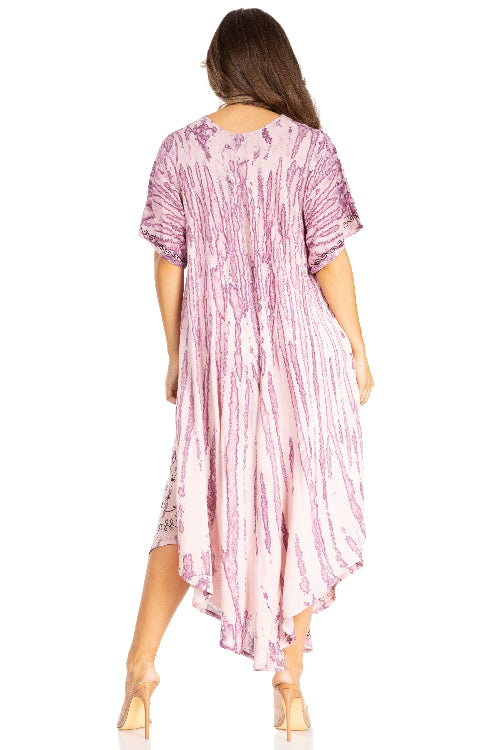 Woman wearing a pink and white patterned dress on a white background