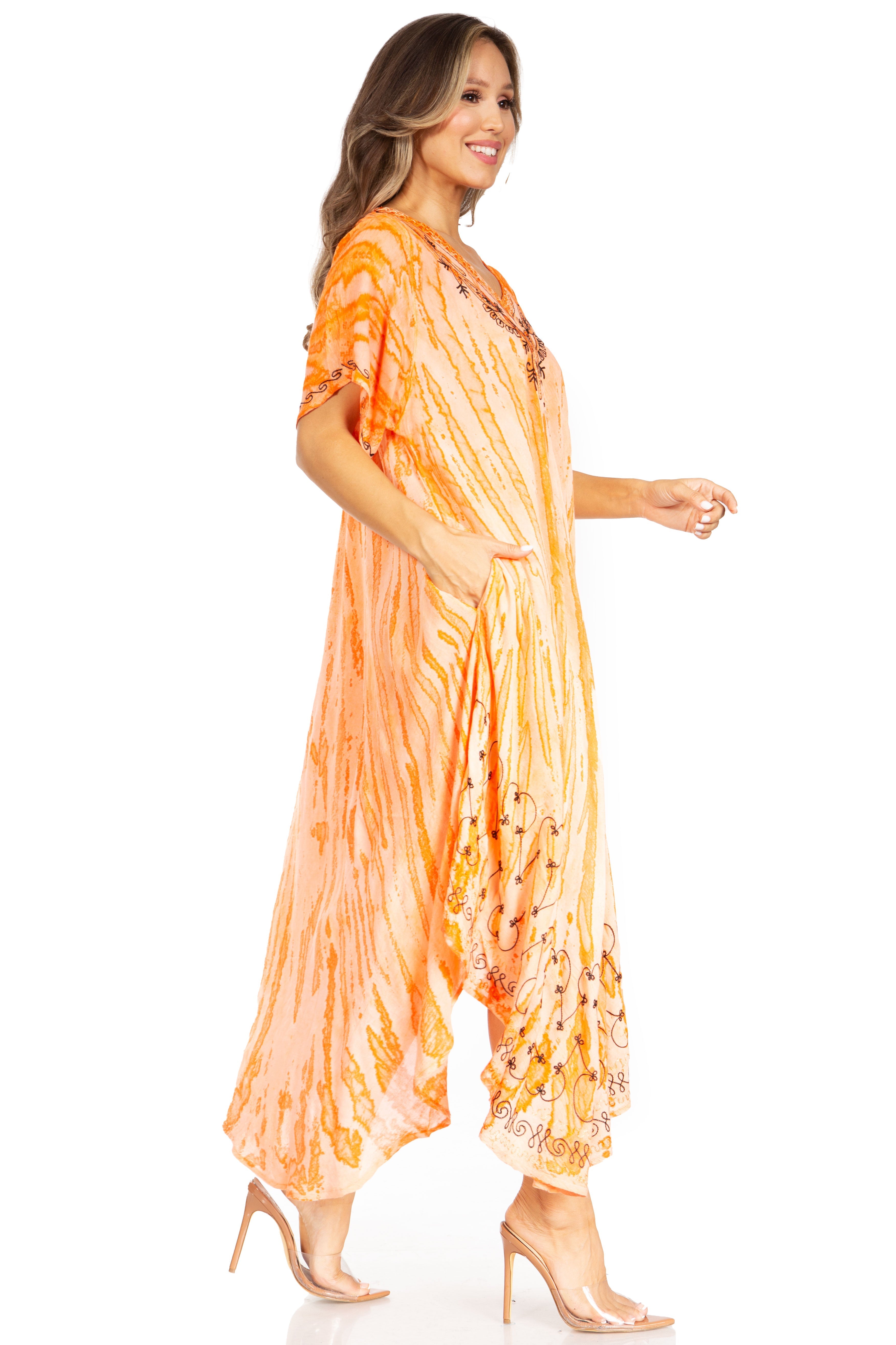 Woman wearing an orange tie-dye dress on a white background
