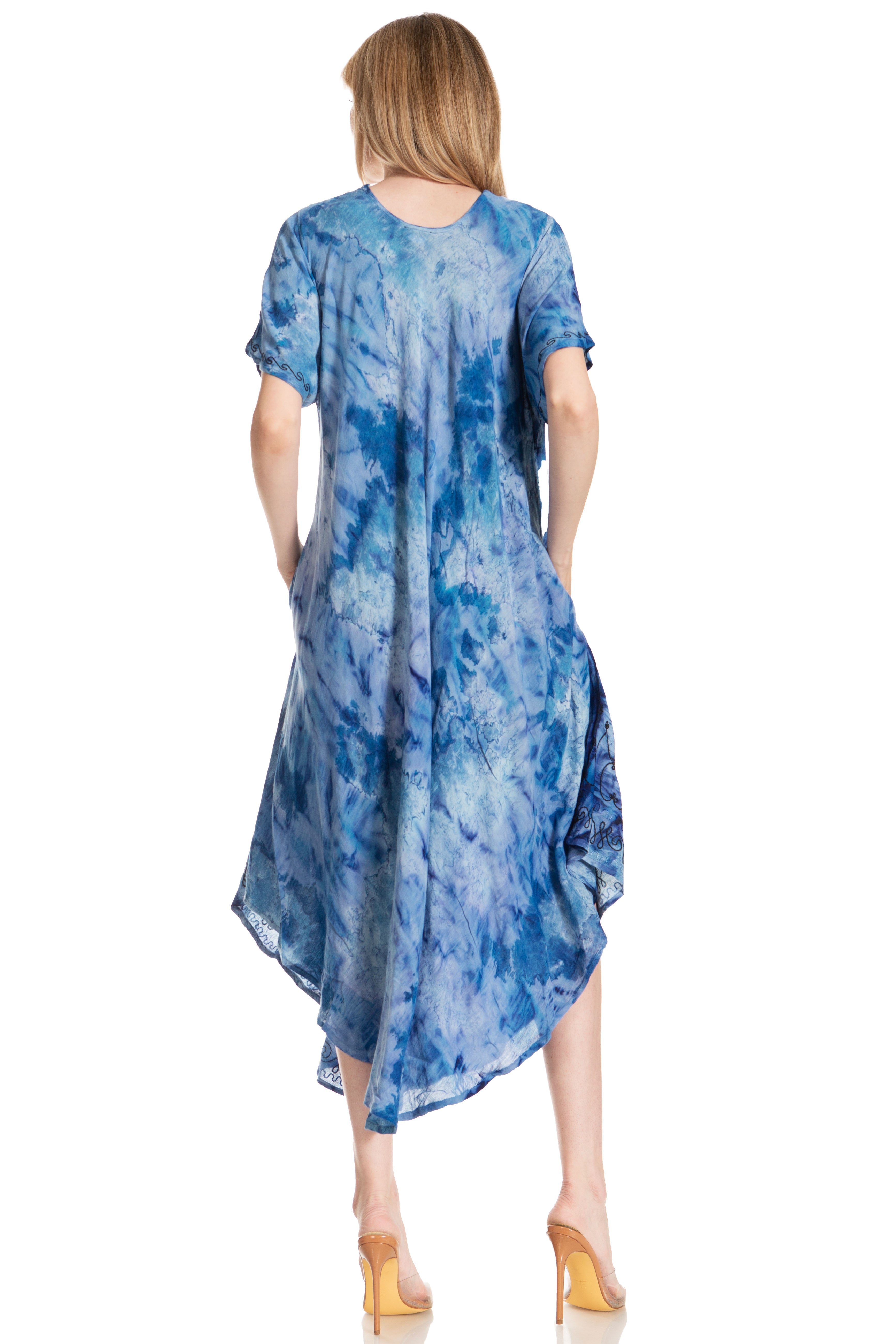 Woman wearing a blue tie-dye dress on a white background