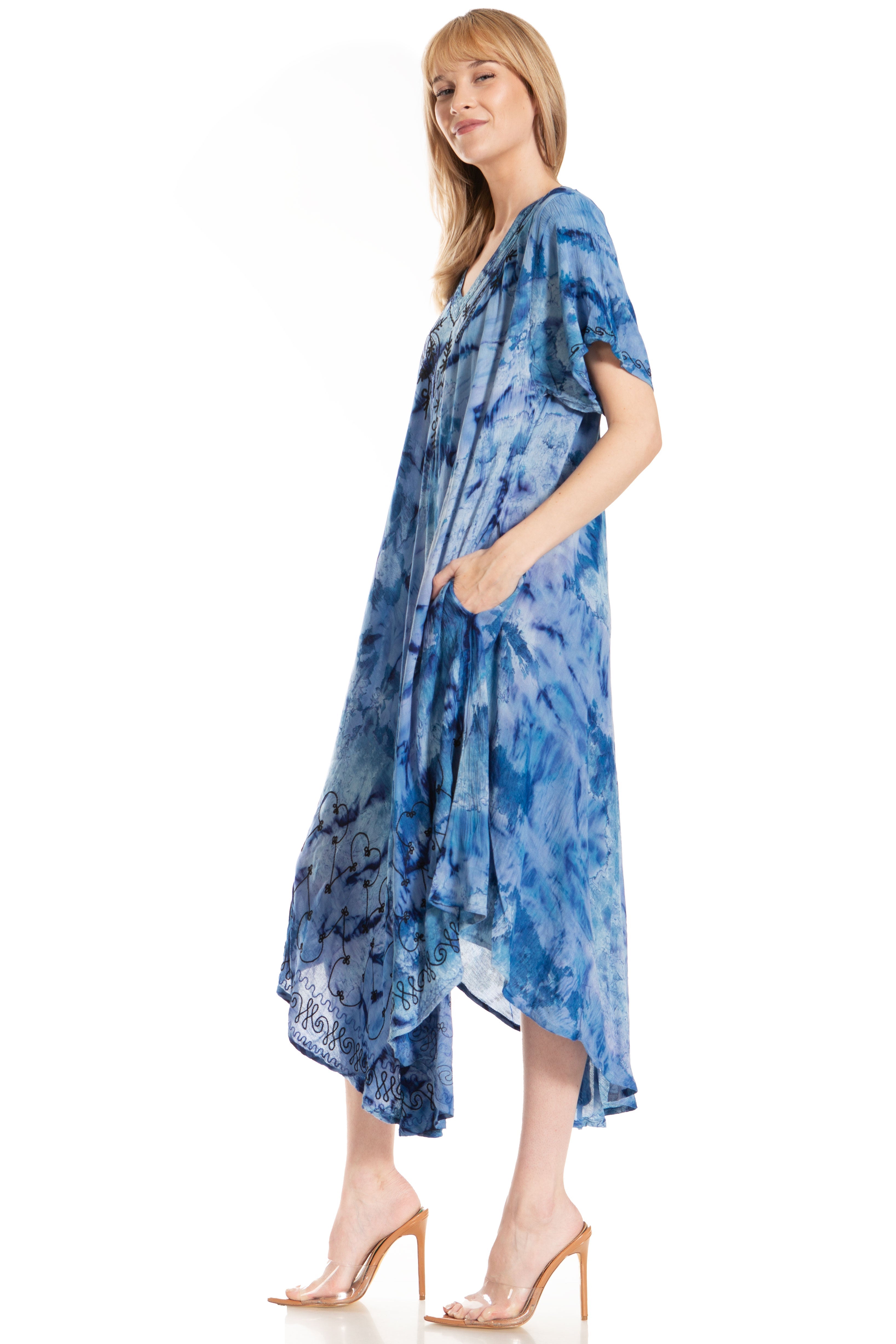 Woman wearing a blue tie-dye dress on a white background
