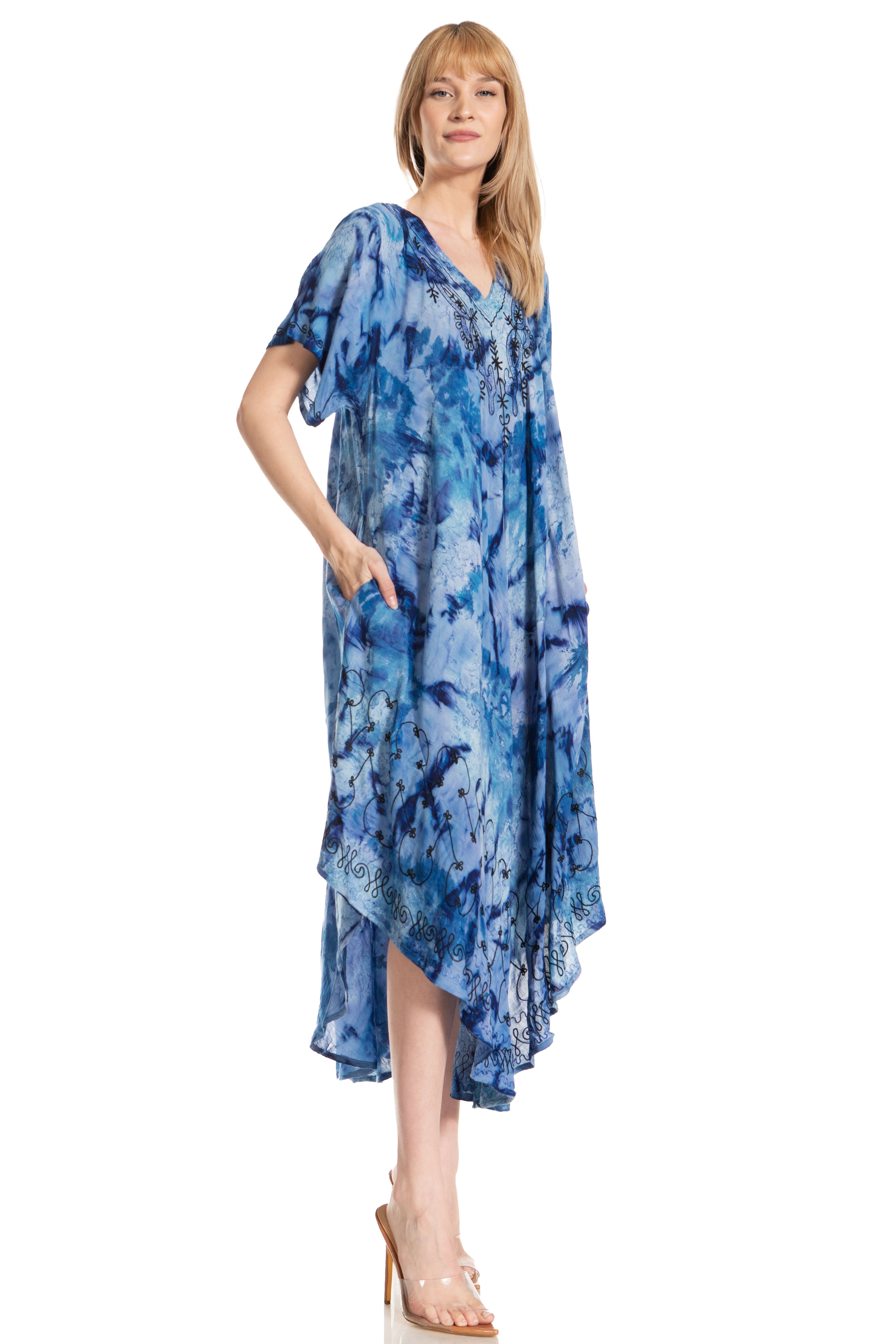 Woman wearing a blue tie-dye dress on a white background