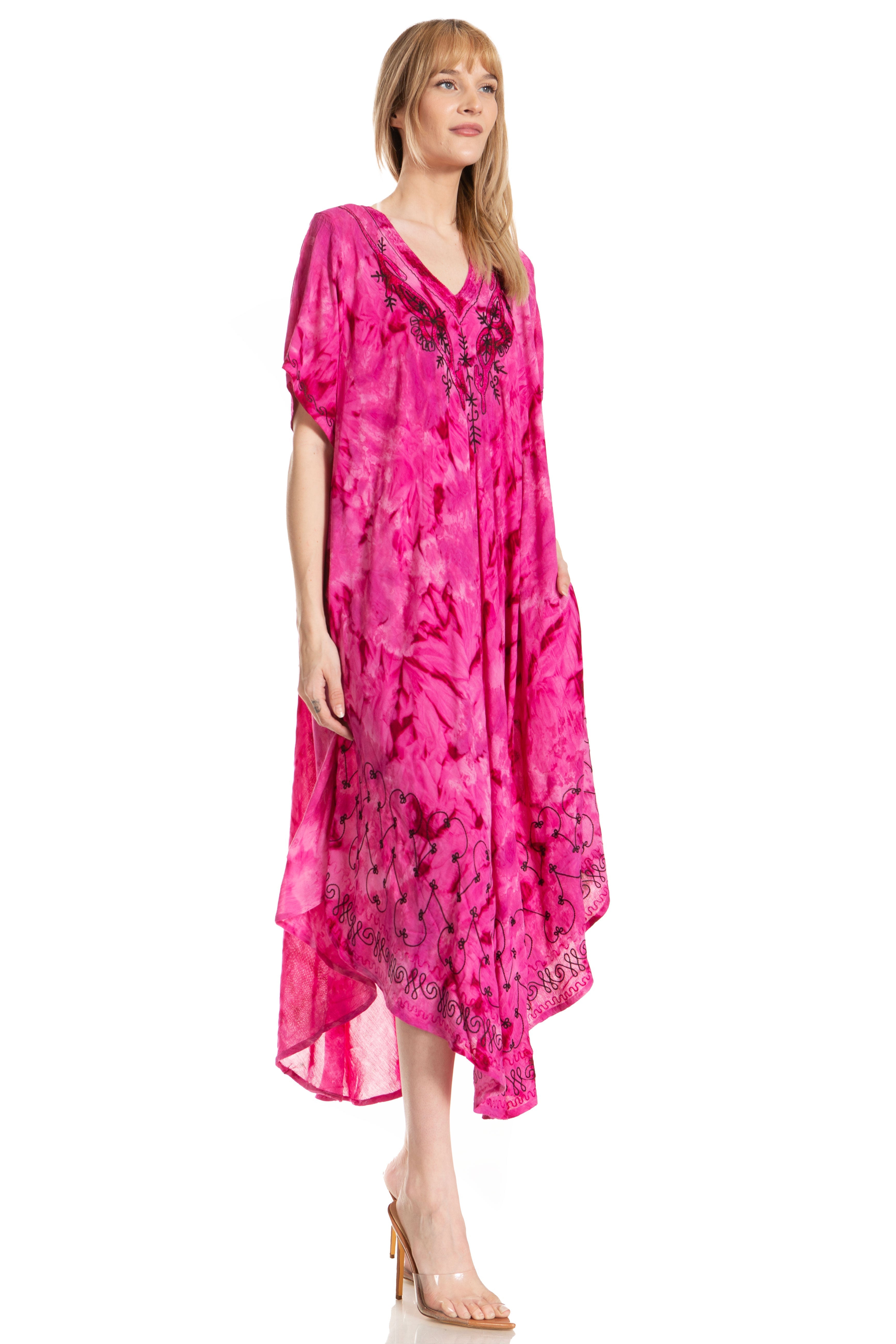Woman wearing a pink dress with a floral pattern on a white background