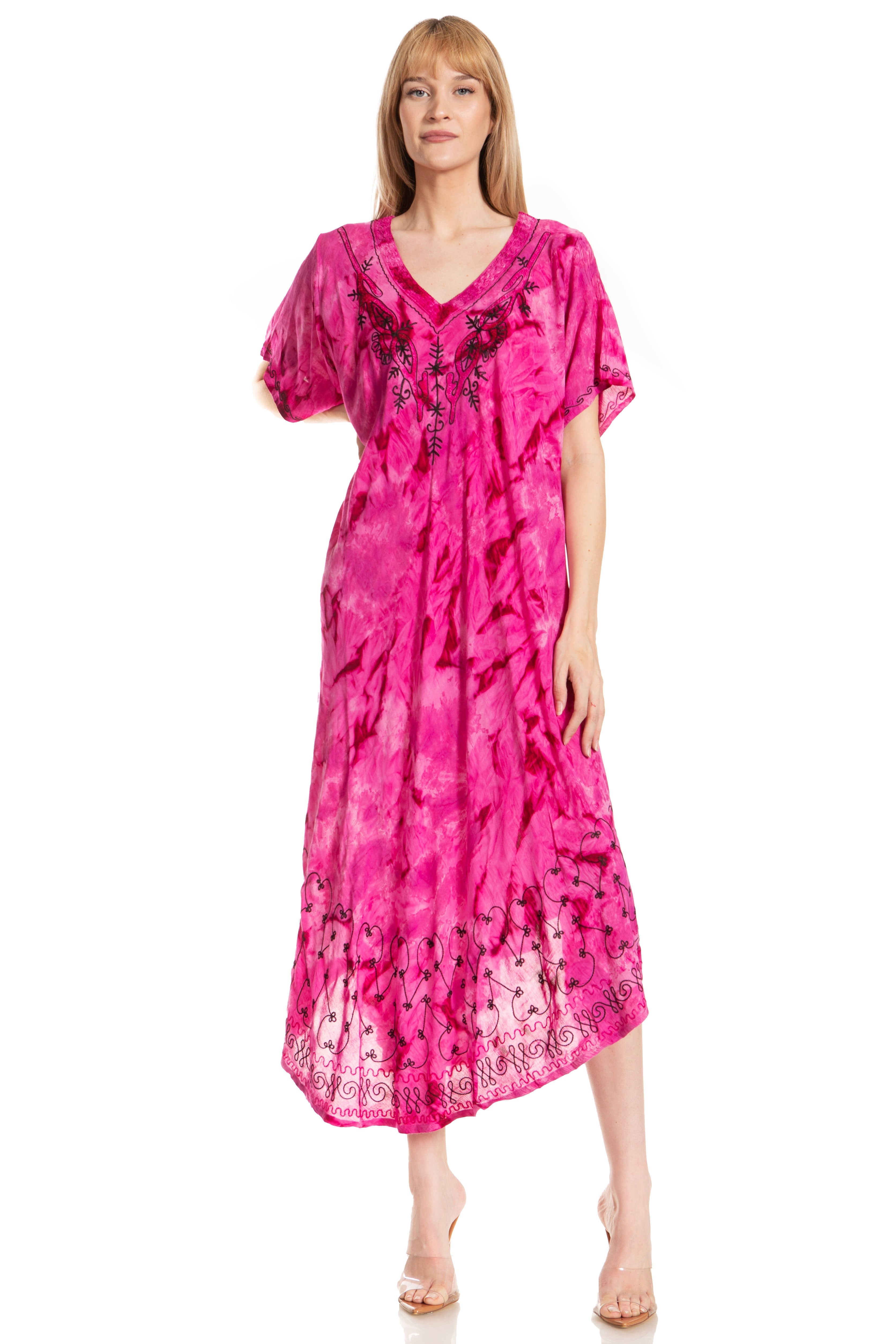 Woman wearing a pink tie-dye dress with lace details on a white background