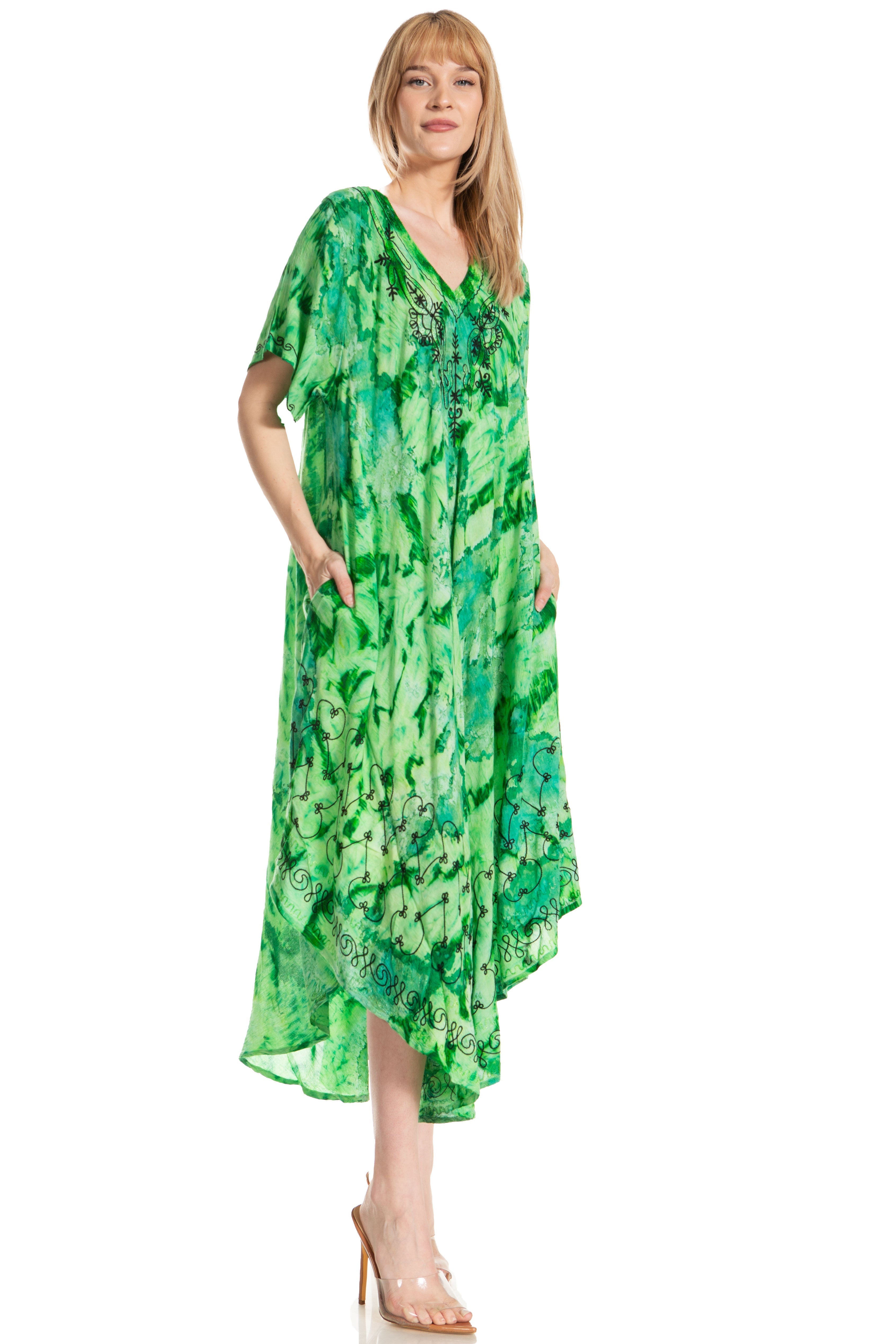 Woman wearing a green patterned dress on a white background